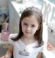 Girl wearing a silver tiara headband with sparkling heart-shaped rhinestones - Silver Plated 1