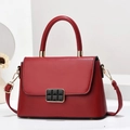 Detail view of deep red leather handbag with gold square buckle and detachable strap - L24cm x W8cm x H16cm / Wine Red