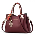 Elegant burgundy leather handbag with silk scarf wrapped handle and leaf charm - Wine Red