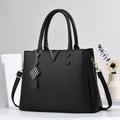 Classic black handbag with lychee texture, golden V-buckle and adjustable strap - Black