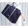 Foldable large capacity travel duffel bag in navy blue with grey reinforced handles - Navy Blue