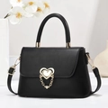 Classic black leather handbag with golden heart clasp and decorative chain for women - Length 24 Width 8 Height 16 / Black