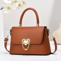 Chic brown leather handbag with gold heart clasp and chain detail for women - Length 24 Width 8 Height 16 / Earthy Yellow