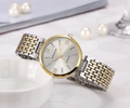 Detailed close-up of crystal-accented quartz watch bezel and Roman numeral markers - Silver Gold White Face