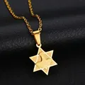 Macro detail of a gold stainless steel hexagram pendant featuring a peace dove relief - Gold Hexagram Dove