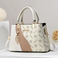 Fashionable monogrammed crossbody bag with bicolor design and gold metal handle accents - Off White