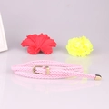 Sottile cintura in pelle intrecciata rosa da donna con fibbia ad ardiglione dorata - Rosa