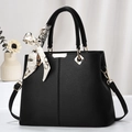 Elegant black lychee leather handbag with gold hardware and silk scarf decoration - Black