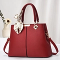 Elegant red lychee leather trapezoid handbag with gold hardware and printed scarf - Wine Red