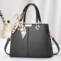 Dark grey pebble leather tote bag with silk scarf accent and golden hardware on white fabric - Gray