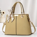 Khaki pebbled leather handbag with decorative silk scarf and adjustable strap for women - Khaki