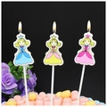 Three-piece princess birthday candles set with colorful dresses on a decorated cake - Long Pole Princess Candle