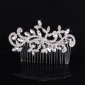 Elegant silver bridal hair comb with rhinestone flower and leaf motifs on black background - Style 8956