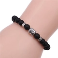 8mm black matte agate buddha head beaded bracelet shown on a wrist display - Black