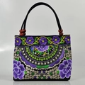 Ethnic black canvas handbag with purple floral embroidery and wooden bead handles - Apple Blossom Purple