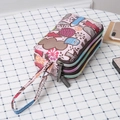 Pink cartoon forest canvas wristlet with three zipper pockets and colorful teeth detail - Pink Forest
