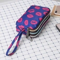 Navy blue canvas triple zipper pouch featuring vibrant pink lips pattern with wristlet - Red Lips