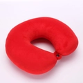 Close-up of red plush travel U-shape neck pillow with secure black snap button fastener - Red