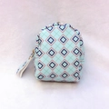 Close-up of mint green vintage coin purse featuring geometric diamond patterns and gold zipper - Light Blue