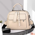 Detail van crème lederen crossbodytas met geweven riem en dubbele metalen ritsen - Khaki
