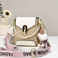 Oumifei printed PU leather crossbody bag in cream and brown with pink wide strap - Off-white