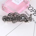 Close-up of vintage peacock hair clip with grey crystals and silver alloy relief - Retro Peacock Relief - Grey