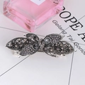 Detailed view of a vintage silver butterfly hair clip with grey crystal rhinestones - Butterfly Shape - Hollow Grey