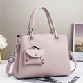 Close-up of pink lychee leather handbag with silver hardware and mini coin pouch - Grey Pink