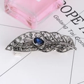 Detail of vintage peacock feather hair clip with blue gemstone and rhinestones - Peacock Feather - Sapphire Blue