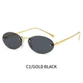 Gafas de sol ovaladas sin montura con montura de metal dorado y lentes negro grisáceo - Montura Dorada Negro Gris
