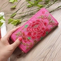 Close-up of pink long fabric wallet featuring detailed peony floral embroidery and zipper - Rose Red