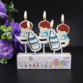 Cartoon baby boy and bottle birthday candles set with blue Baby Boy text for parties - Baby Boy Bottle Candle
