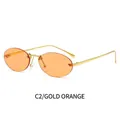 Gafas de sol ovales sin montura con montura de metal dorado y lentes naranjas - Montura Dorada Lentes Naranjas