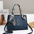 Navy blue pebble leather handbag with silk scarf handle and golden leaf pendant charm - Blue