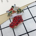 Christmas boot brooch with red rhinestones and white relief detail on a festive pin - 425 Christmas Boots
