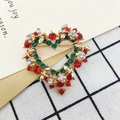 Golden heart brooch with red and green rhinestones and floral details on a gift card - 422 Heart Wreath