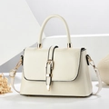 Elegant beige leather crossbody bag with gold hardware and top handle for women - White