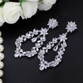Elegant floral silver drop earrings with AAA cubic zirconia in sparkling petal design - White
