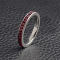 Silver stainless steel eternity ring with full circle of red birthstone stones - January (Garnet)