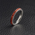 Silver eternity ring with sparkling red birthstone crystals on black leather - November (Citrine)