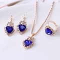 Detailed view of elegant blue heart crystal jewelry set including necklace, ring and earrings - Heart / Sapphire Blue