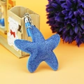 Detailed view of blue starfish keychain with rhinestones, leather tassel and silver ring - Silver Wire Light Blue