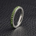 Minimalist stainless steel eternity ring with channel-set round green gemstones - US 7 / August (Peridot)