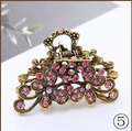 Vintage bronze alloy hair claw clip with pink rhinestones and floral hollow design - Pink