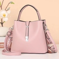 Pink minimalist bucket crossbody bag for women with decorative wide strap and silver buckle - Pink