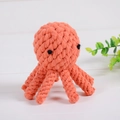 Handwoven octopus cotton rope dog toy in vibrant coral orange for pet teething - Octopus