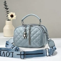 Light blue quilted leather crossbody bag with triple zippers and woven LOVE strap - Blue