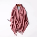 Pink and grey double-sided knitted shawl wrap with fringe tassels on a wooden hanger - Dusky Pink