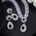 Macro shot of silver bridal jewelry set with black stones and white zircons - White Gold Black Zirconia