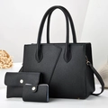 Black lychee leather 3-piece bag set with tote, clutch and card holder in 45-degree view - Black